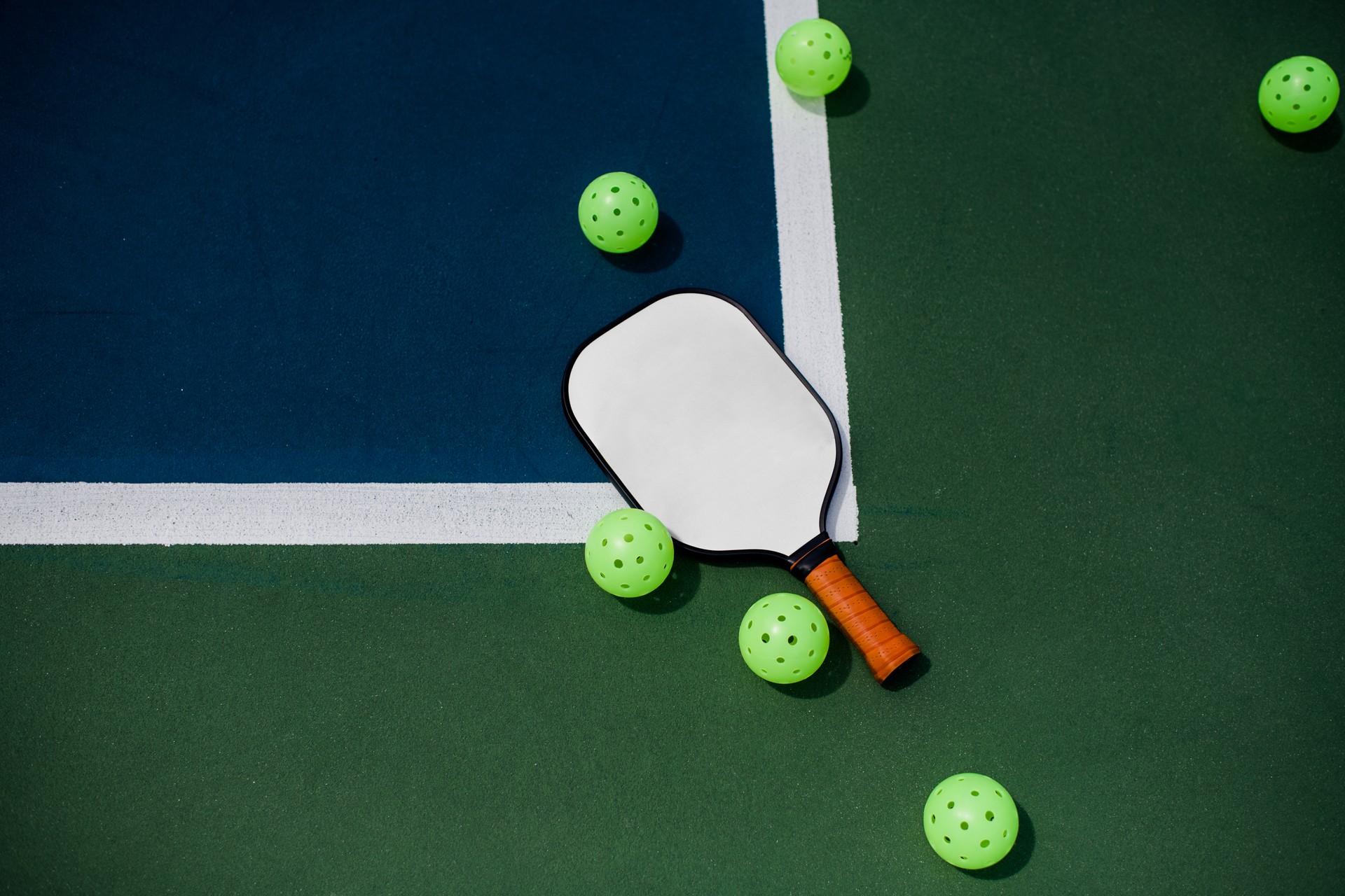 Pickleball court, paddle and balls